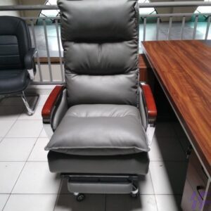 "Black executive leather office chair with padded seat, ergonomic backrest, and swivel base."