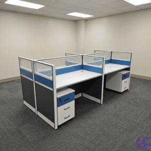 Angled overview of a modern white and blue 4 Way Cubicle Workstation showing four connected desks separated by frosted glass privacy screens.