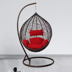 Rattan hammock swing chair set up on a modern outdoor patio