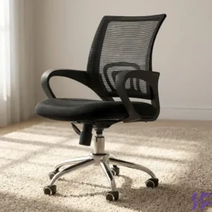 Ergonomic black mesh office chair with breathable high back, padded seat, fixed armrests, and chrome swivel base on wheels, styled on a neutral rug for a home office or professional workspace.
