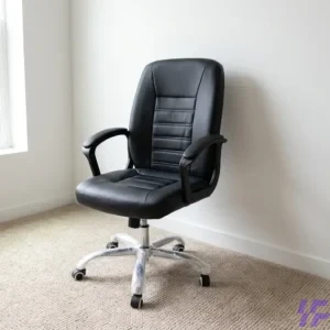 An ergonomic medium back leather office chair featuring a sleek black PU leather finish and horizontal ribbed stitching for a sophisticated, professional look. This swivel executive chair is designed with a contoured backrest to provide essential lumbar support, paired with integrated armrests for enhanced comfort during long working hours. The sturdy chrome star base includes smooth-rolling swivel casters, making it a highly mobile and durable adjustable computer chair suitable for home offices or corporate workspaces. Ideal for those seeking a stylish yet functional mid-back task chair, this piece combines modern aesthetics with practical features to improve daily workplace productivity.