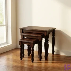 Set of three interlocking wooden nest stools with a natural oak finish and minimalist design, ideal for space-saving side tables or additional seating.