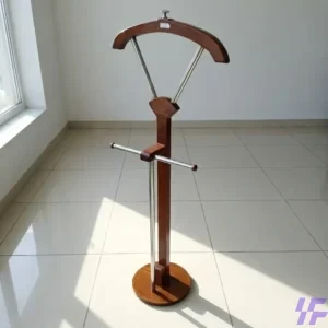 Modern vertical wooden coat hanger with a freestanding tripod base and multiple hanging hooks for organized entryway storage of coats, hats, and bags.