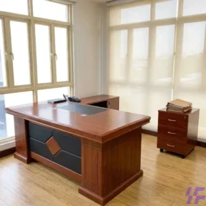 L-shaped executive office table with spacious work surface, integrated storage, and modern design, ideal for professional workspaces, home offices, and corporate setups in Kenya