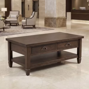 A professional dark wood Walnut Wood Coffee Table holding corporate magazines between two black leather lobby chairs.