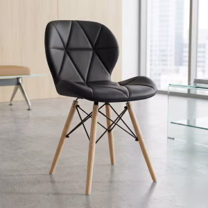 A luxury velvet Triangle Tufted Dining Chair with sleek black legs positioned neatly around a modern mahogany wooden dining table setup.